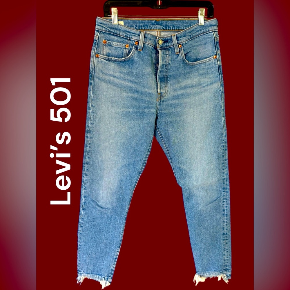 Levi’s-women’s button fly 501 jeans. 28x28 light wash/frayed hem. Excellent cond